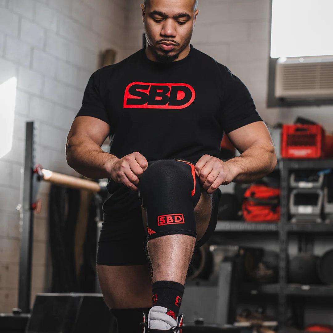 SBD Knee Sleeves being put on