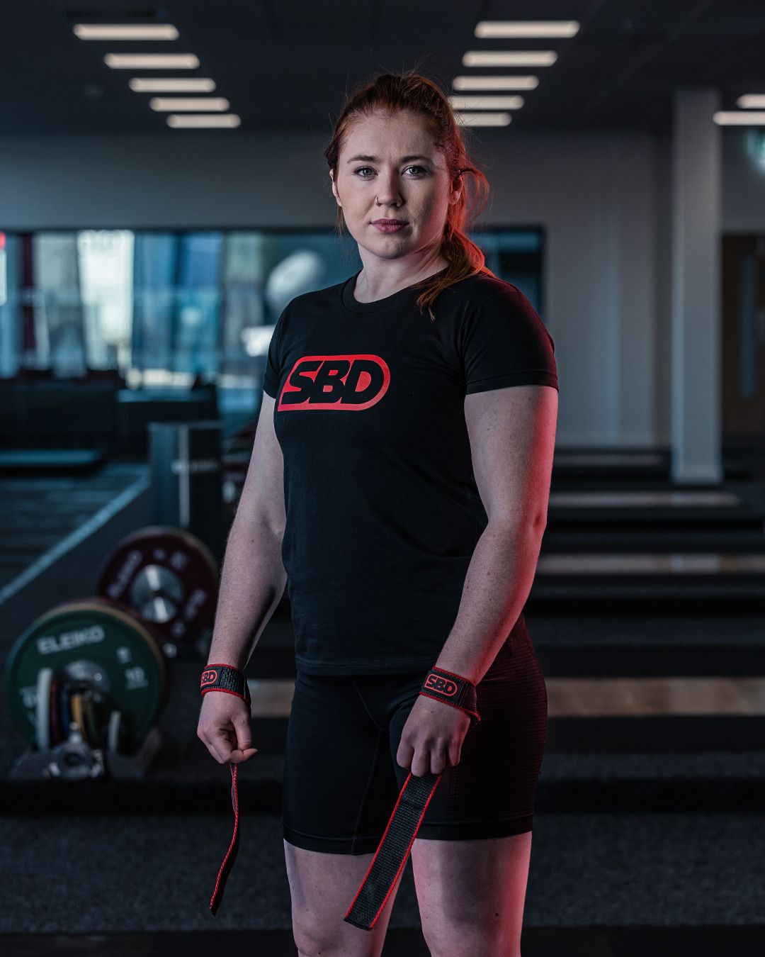 woman wearing lifting straps